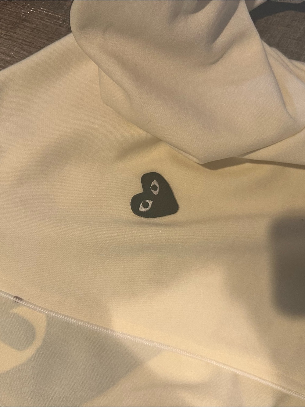 Comme des Garcons Cream Hoodie with Black Heart Logo